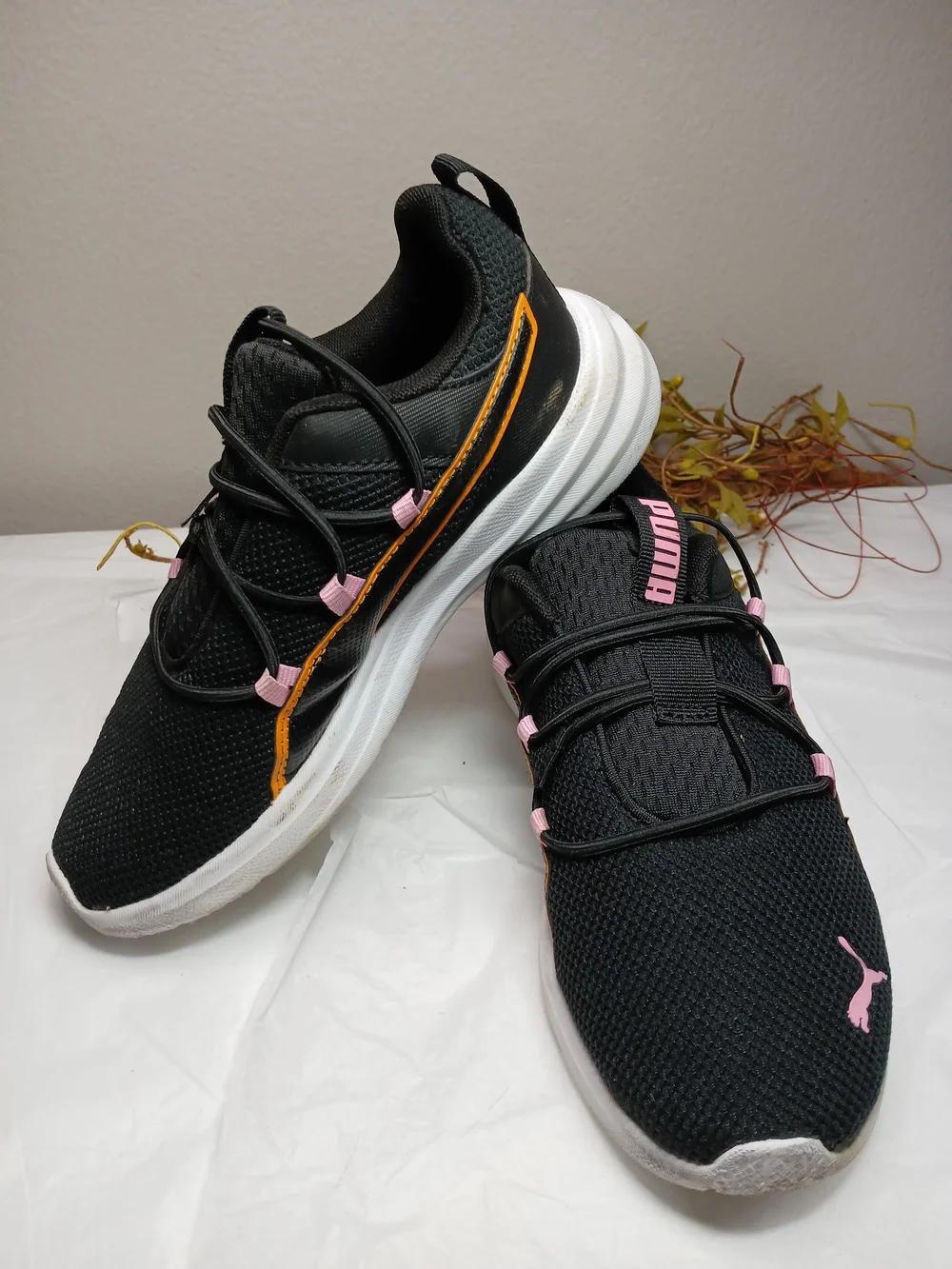 Puma Black Sneakers with Pink Accents and Orange Trim